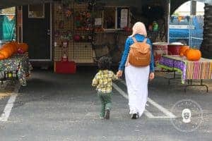 Fawn Design Backpack diaper bag walking away