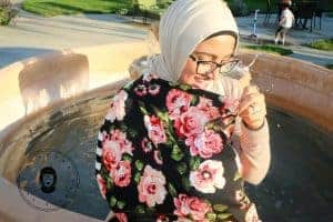 Nursing with my multi-use nursing cover in public