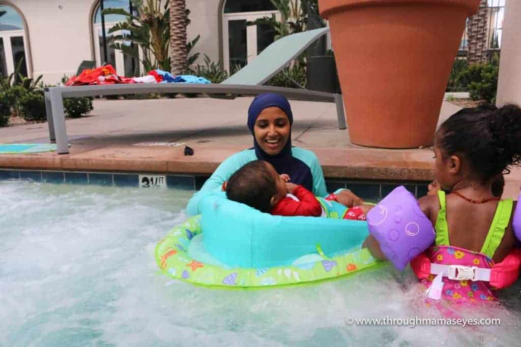 Swim Safely with Swimways Infant Baby Spring Float How to Relax at the Pool or Jacuzzi with your baby Swim Safely with 3 kids Swimming Safety Summer Floats www.throughmamaseyes.com